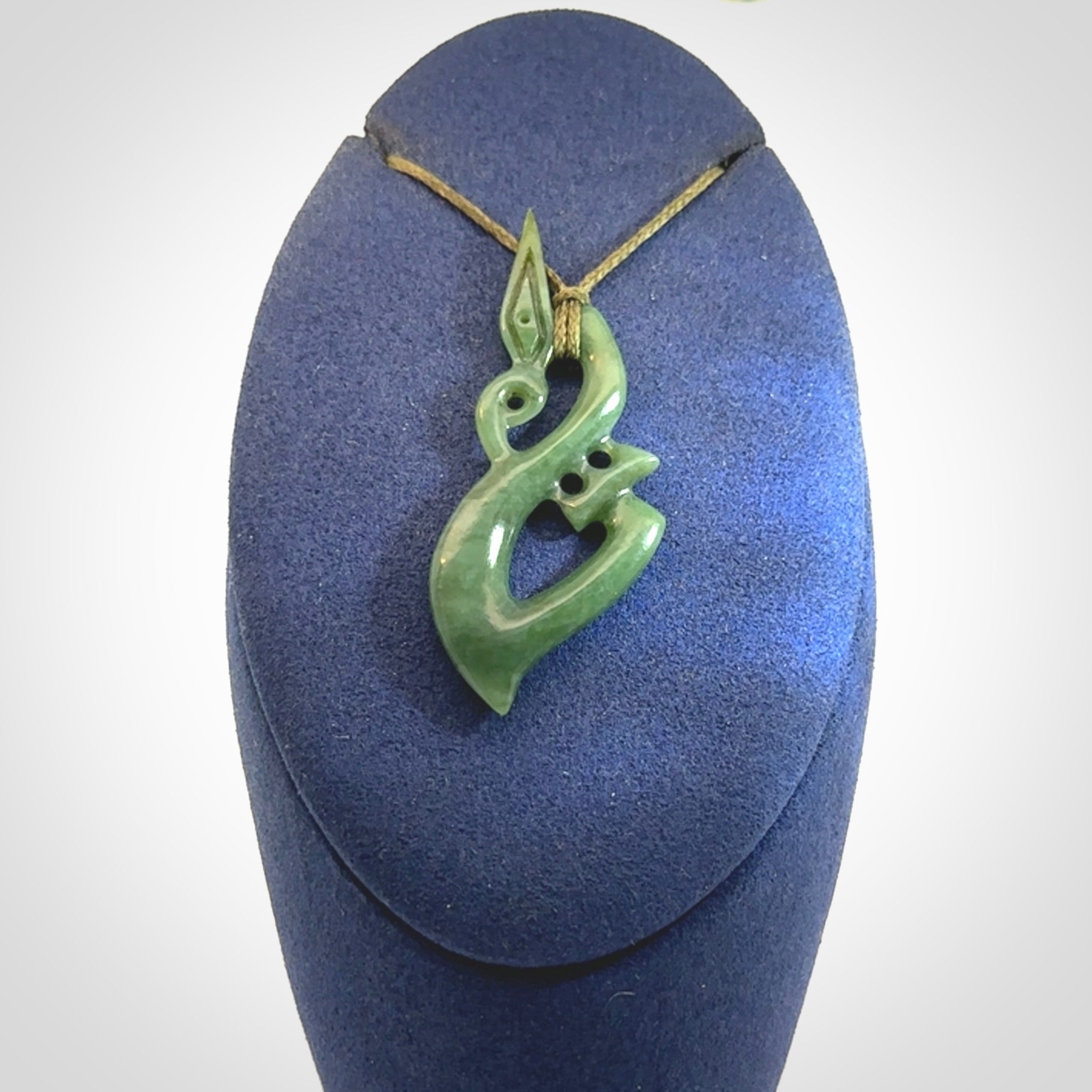 A very cool Manaia pendant carved in Inanga Jade