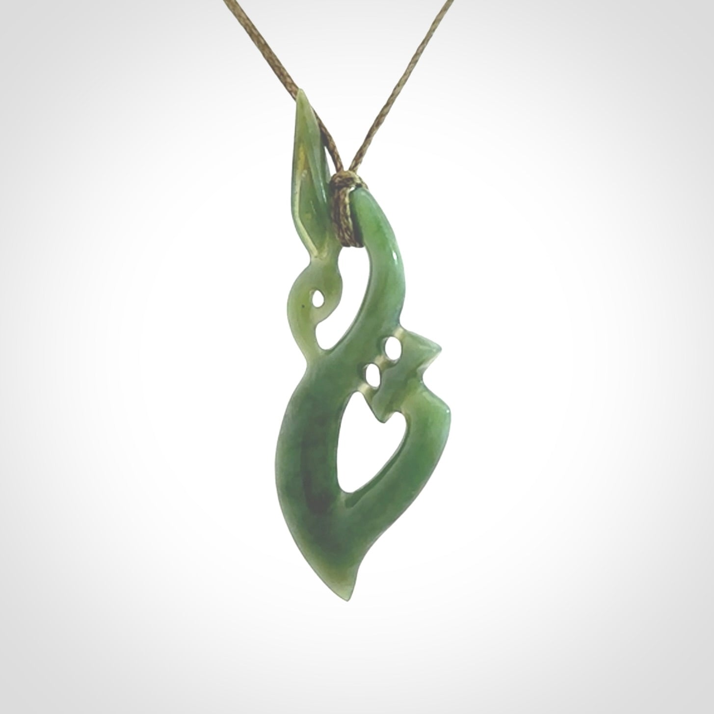 A very cool Manaia pendant carved in Inanga Jade