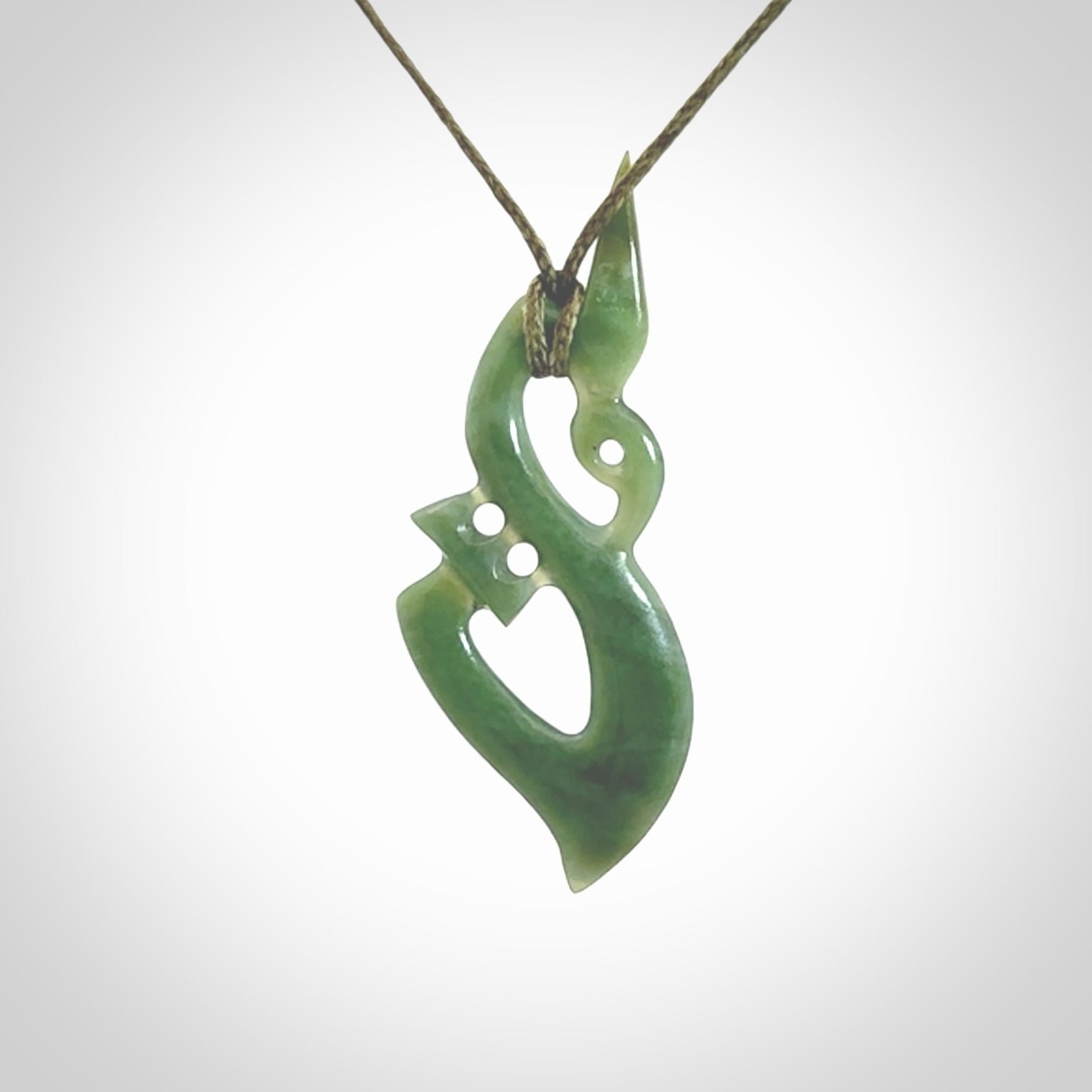 A very cool Manaia pendant carved in Inanga Jade