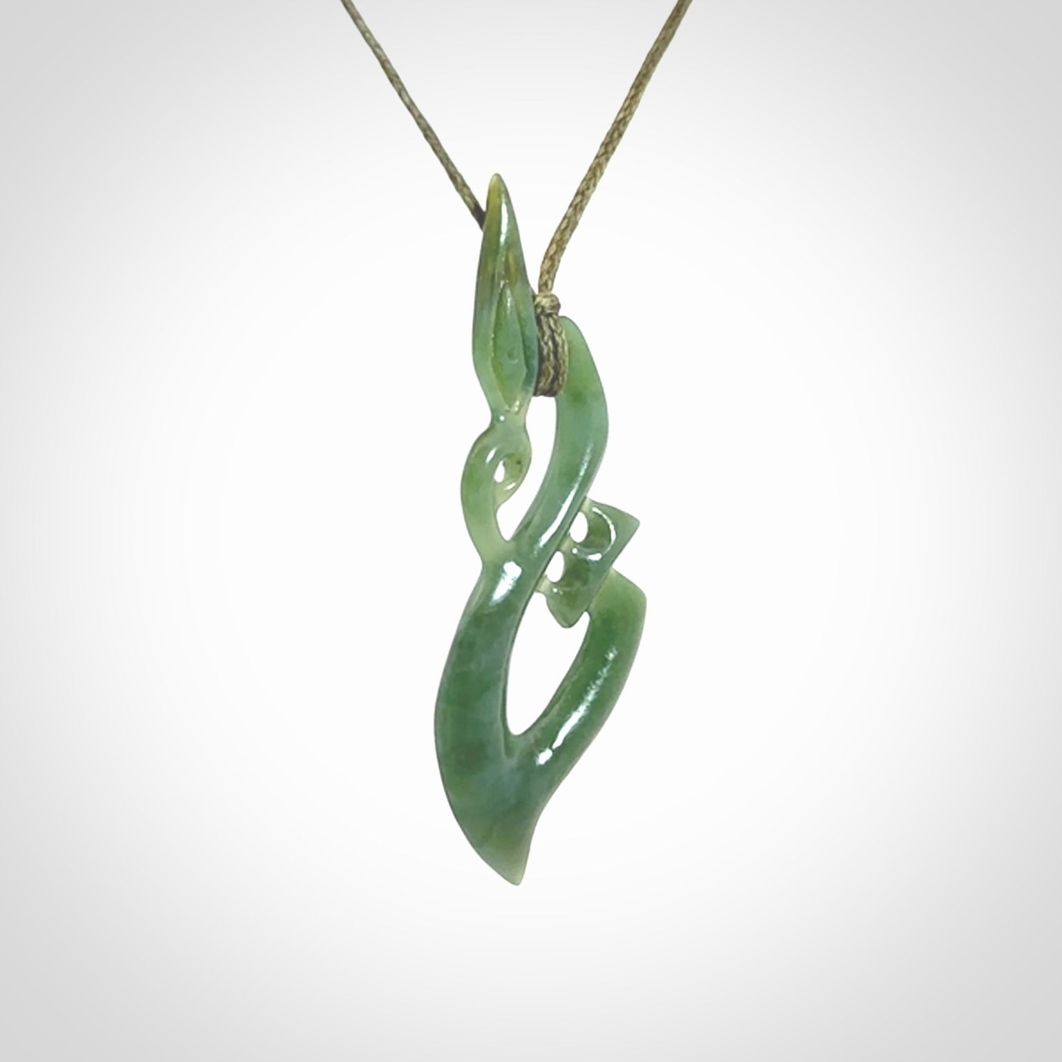 A very cool Manaia pendant carved in Inanga Jade