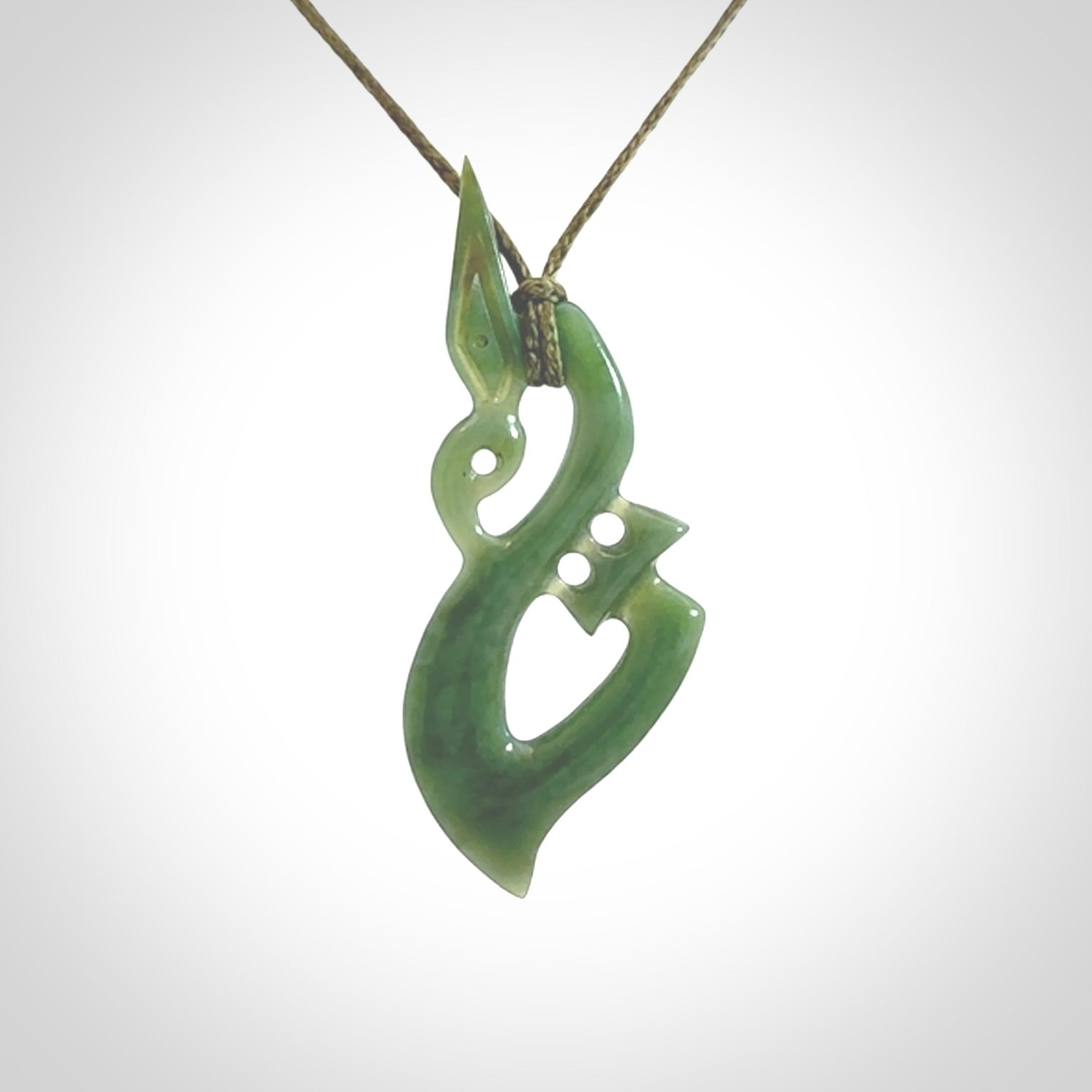 A very cool Manaia pendant carved in Inanga Jade