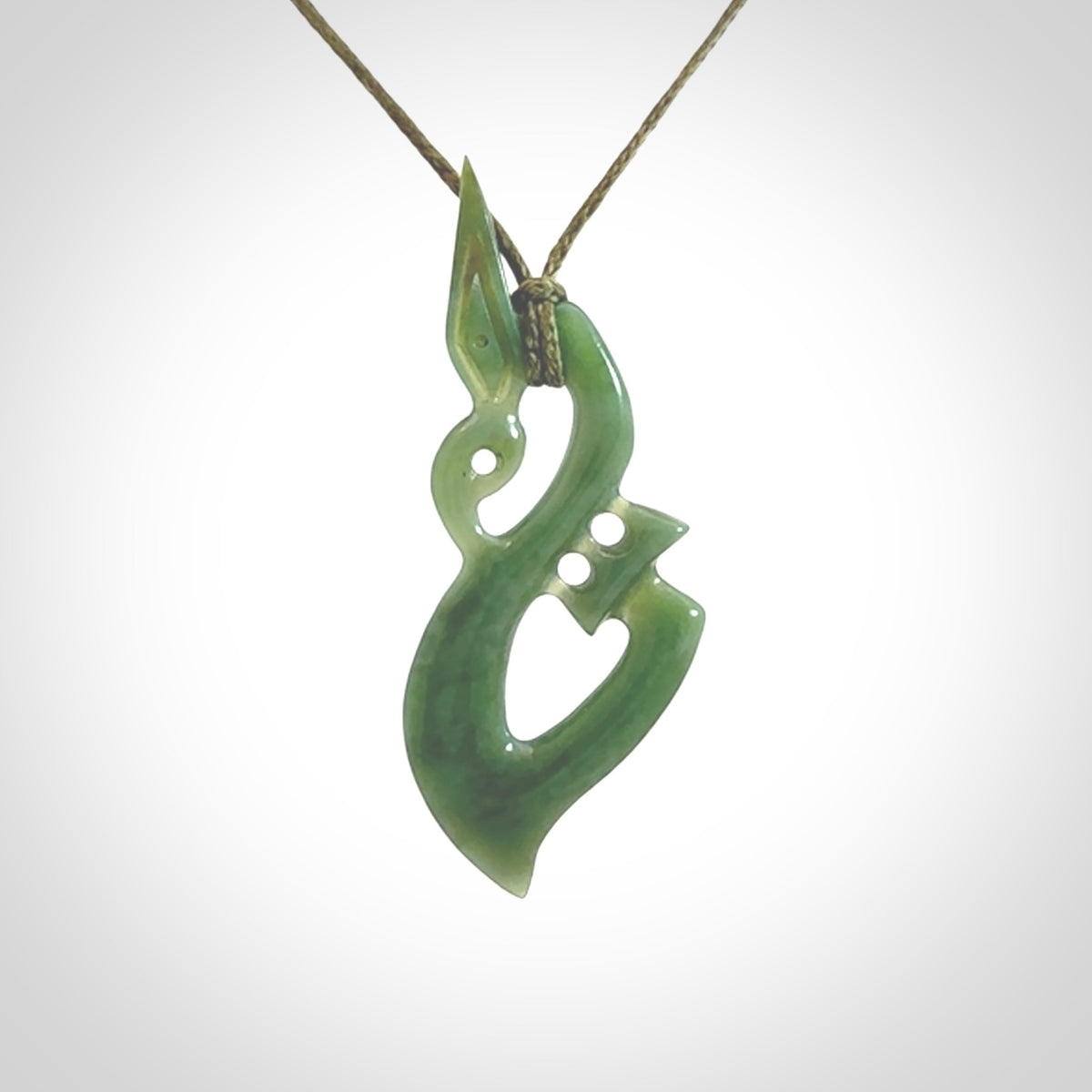 A very cool Manaia pendant carved in Inanga Jade