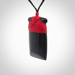 Hand carved black jade toki pendant. Made by NZ Pacific from Australian black jade. Black Jade Toki provided with adjustable cords and packaged in a woven kete pouch. Delivered with express courier.