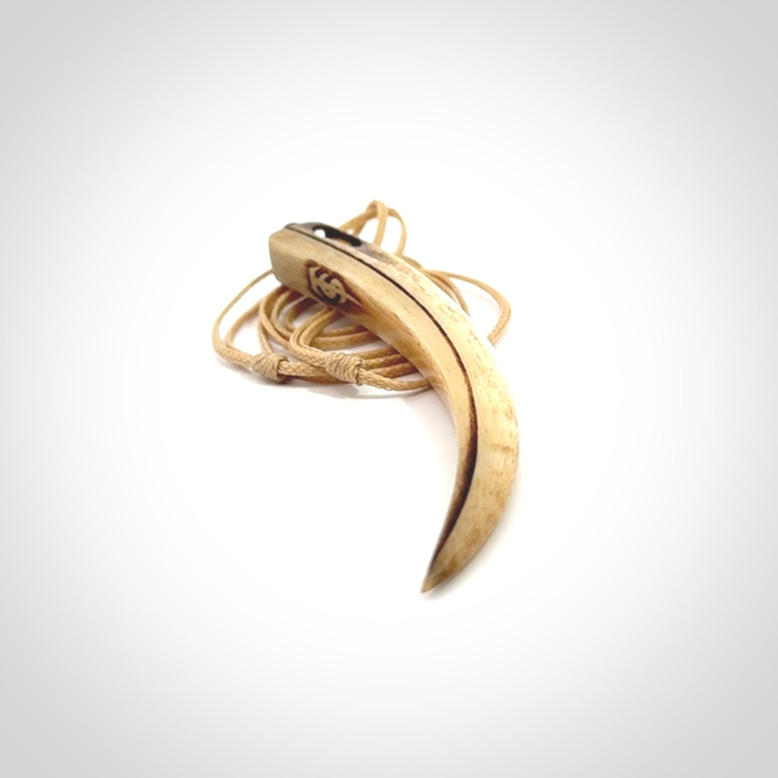 This is a hand carved rams horn huia bird beak pendant. It is made from rams horn with 24 carat gold leaf and jade toggle. This is a large sized necklace and is a very unique, one only, pendant that is a collectors piece. Hand carved by New Zealand artist, Sami.
