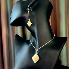 Hand carved mammoth tusk pendant with matching earrings