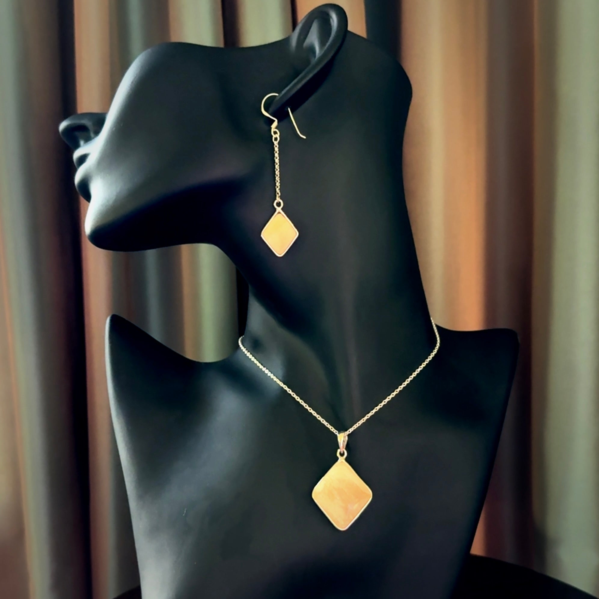 Hand carved mammoth tusk pendant with matching earrings