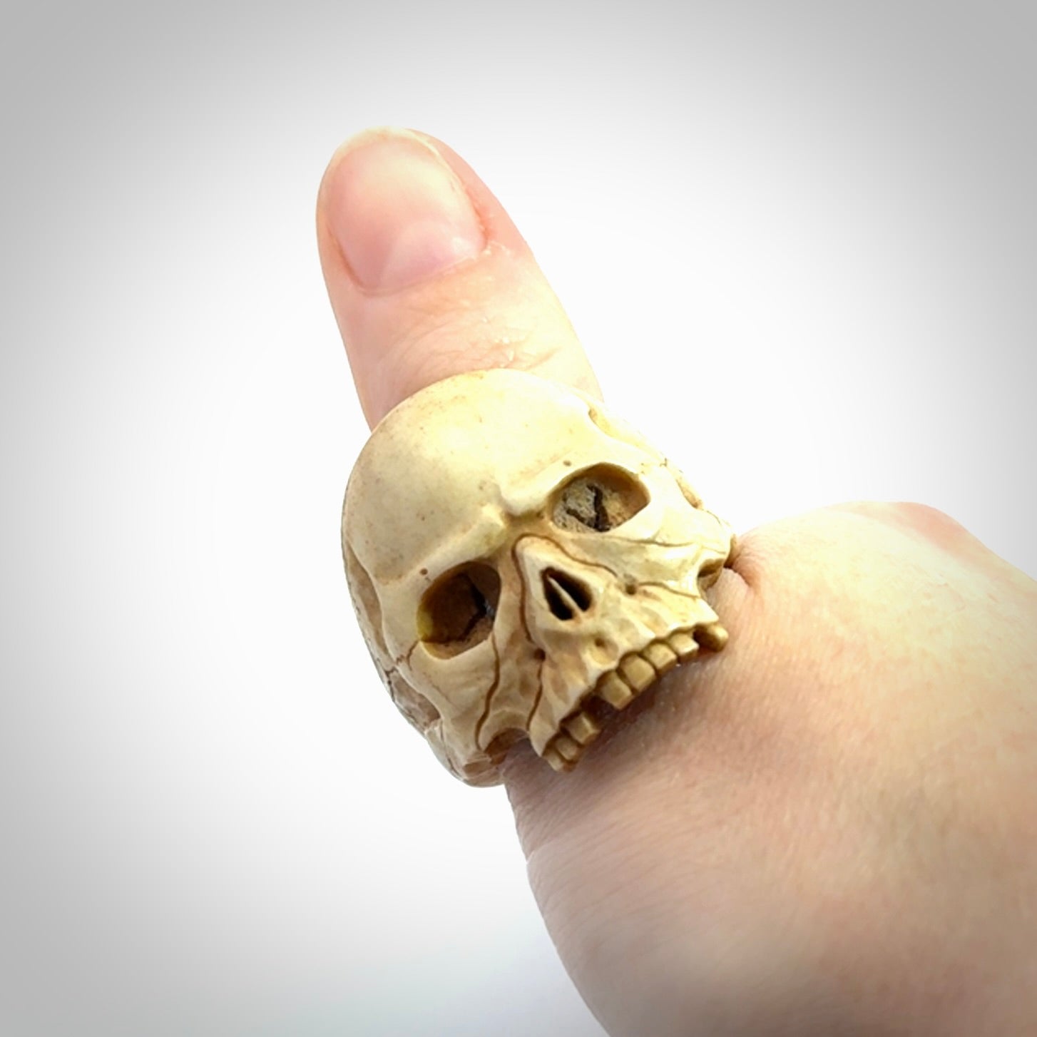 Hand carved skull ring. Made from Red Deer antler in New Zealand. Unique skull ring hand made from deer antler by master bone carver Fumio Noguchi. Spectacular collectable work of art, made to wear. One only ring, delivered to you at no extra cost with express courier.