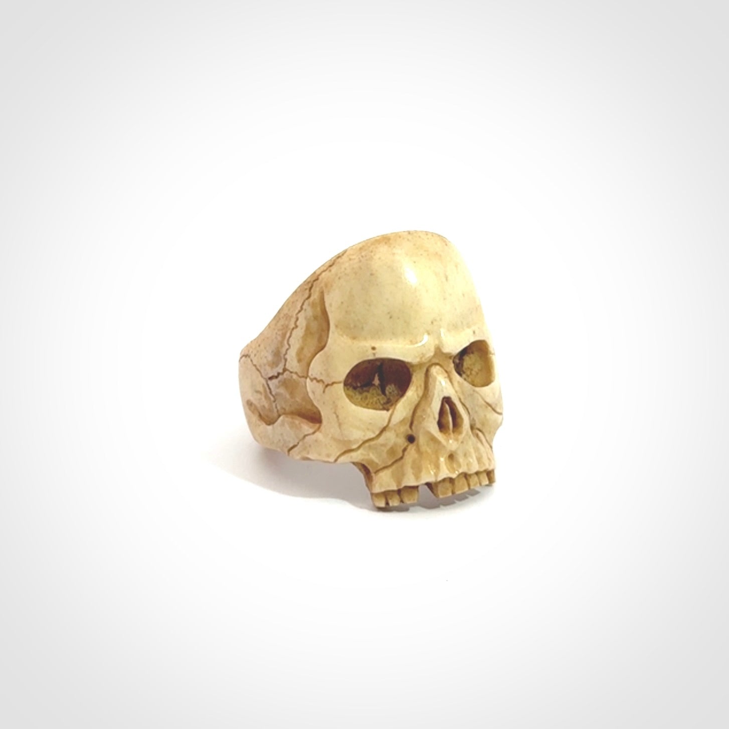 Hand carved skull ring. Made from Red Deer antler in New Zealand. Unique skull ring hand made from deer antler by master bone carver Fumio Noguchi. Spectacular collectable work of art, made to wear. One only ring, delivered to you at no extra cost with express courier.