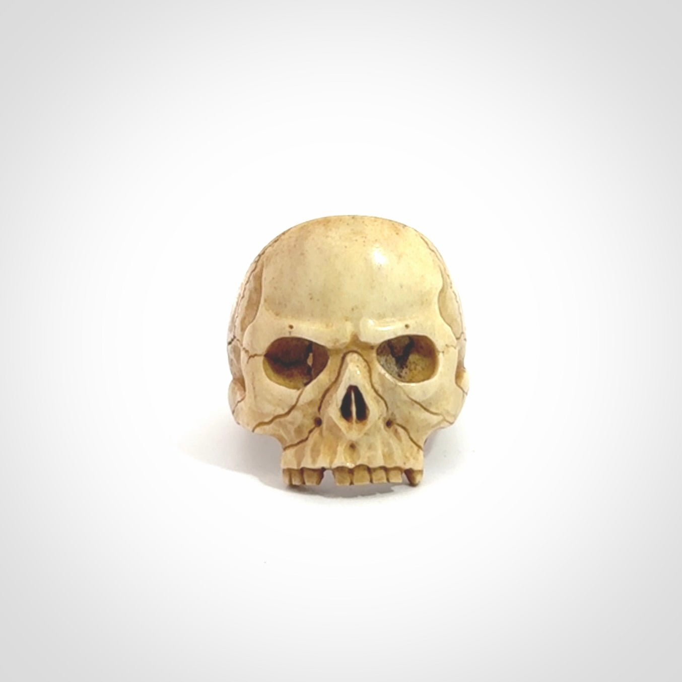 Hand carved skull ring. Made from Red Deer antler in New Zealand. Unique skull ring hand made from deer antler by master bone carver Fumio Noguchi. Spectacular collectable work of art, made to wear. One only ring, delivered to you at no extra cost with express courier.