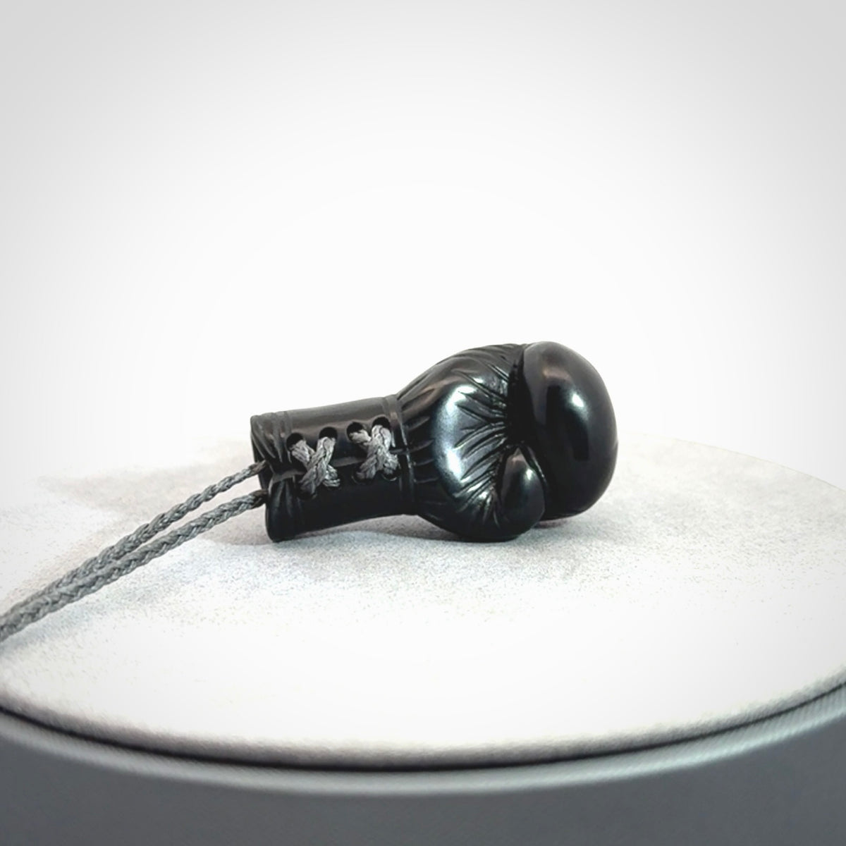 Hand Carved Black Jade Boxing Glove Pendant.