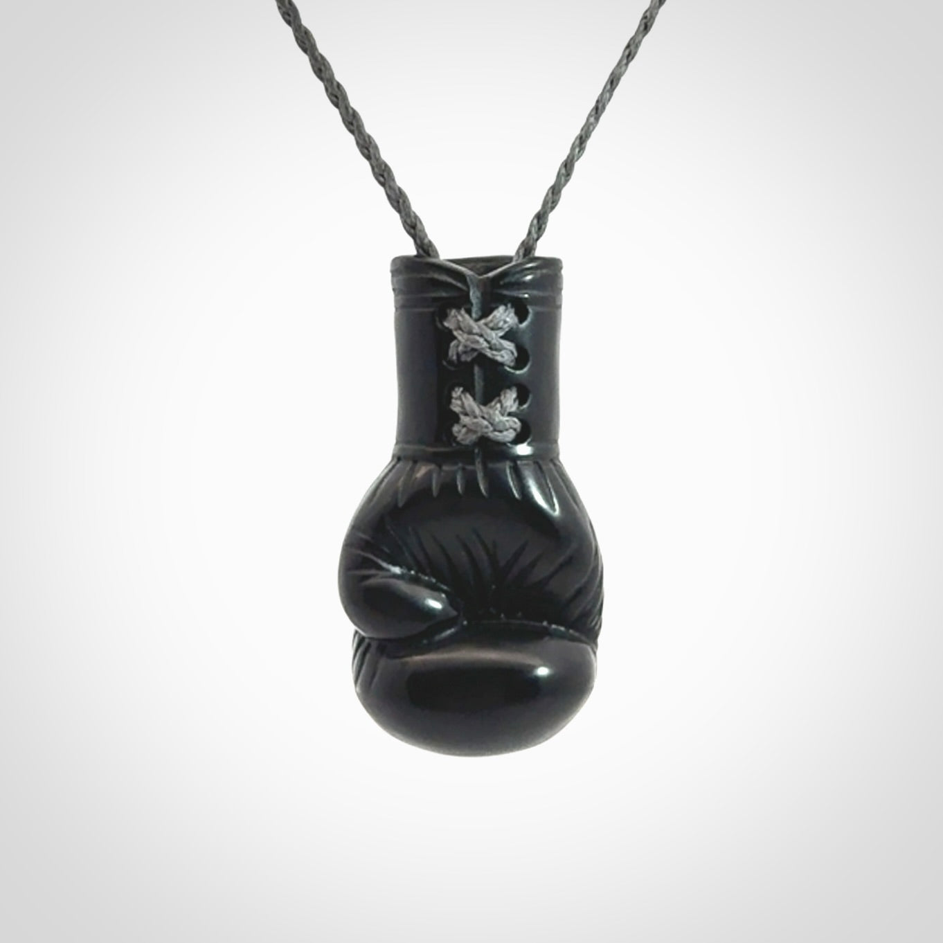 Hand Carved Black Jade Boxing Glove Pendant.