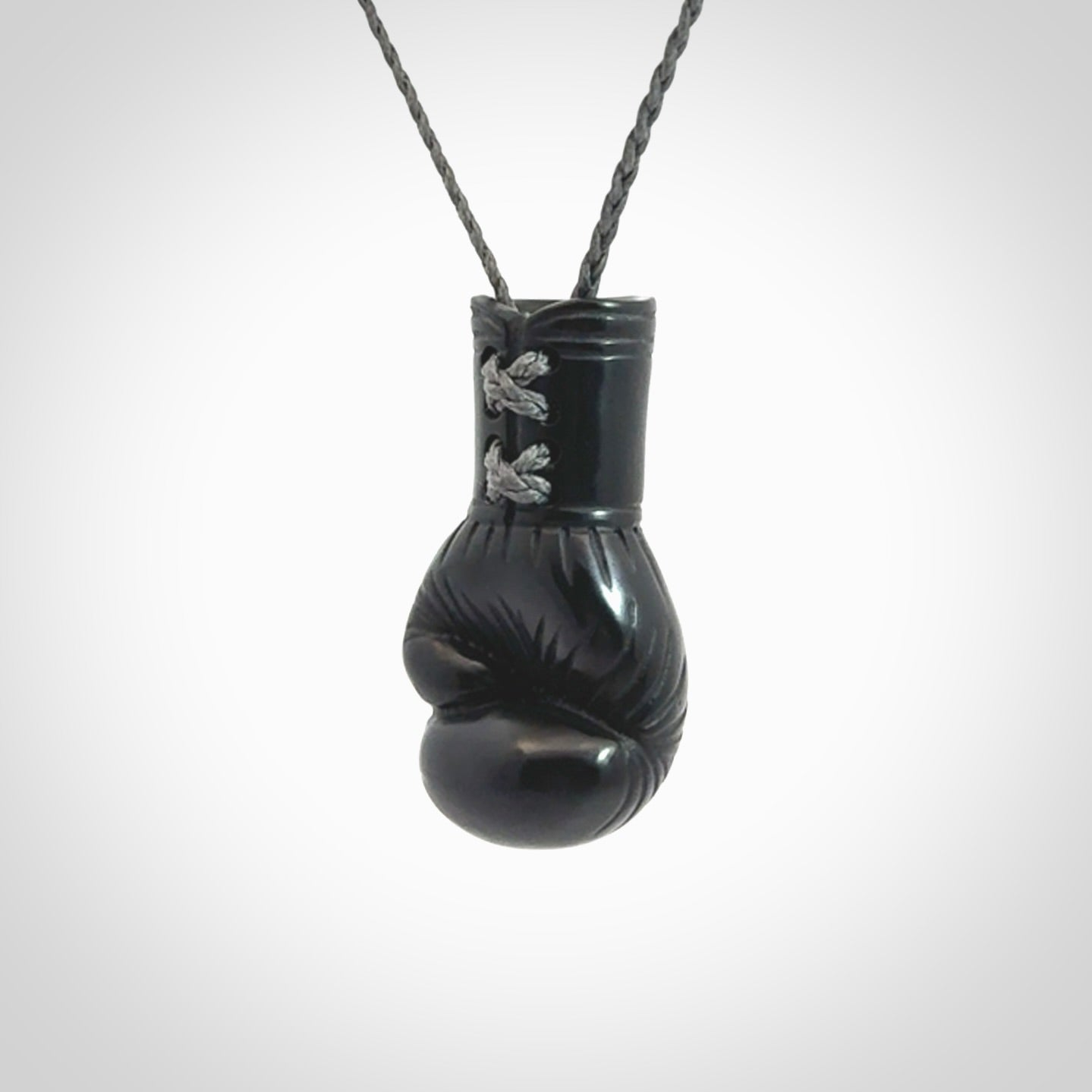 Hand Carved Black Jade Boxing Glove Pendant.
