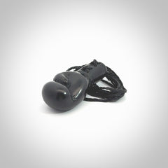 Hand carved boxing glove made from black jade. The cord is adjustable so that you can wear this where it suits you best. We ship these worldwide and the postage is included in the price.