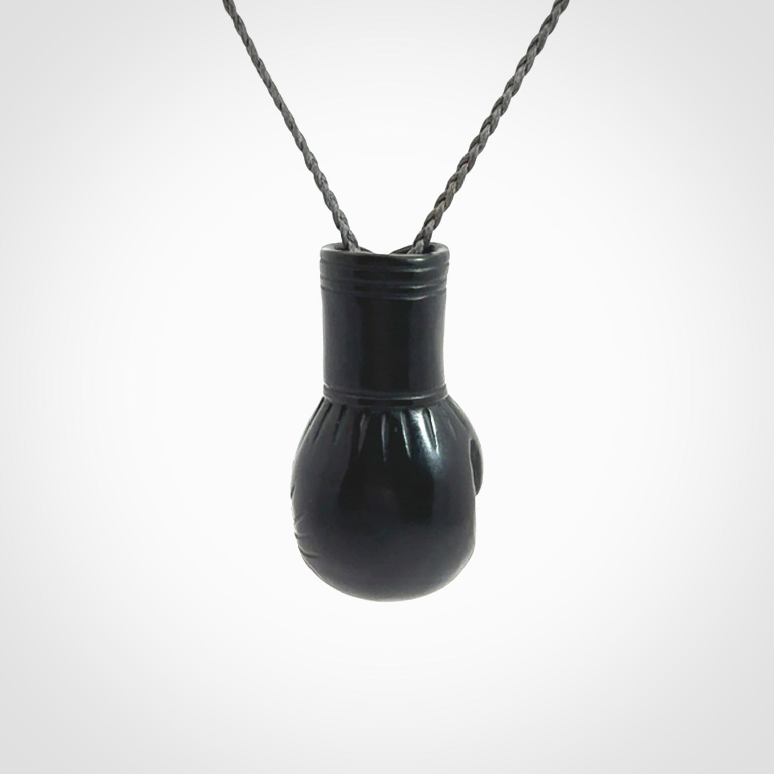 Hand Carved Black Jade Boxing Glove Pendant.