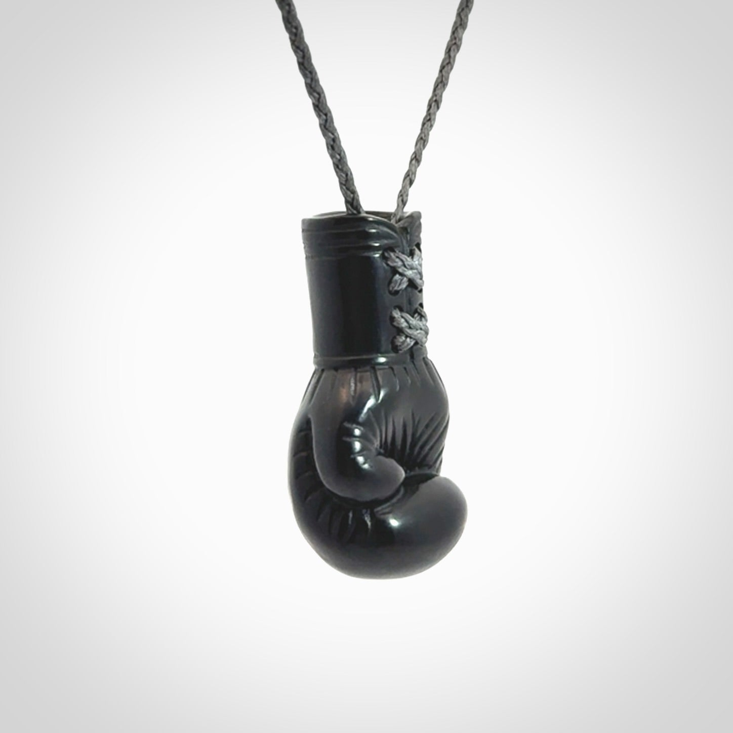 Hand Carved Black Jade Boxing Glove Pendant.