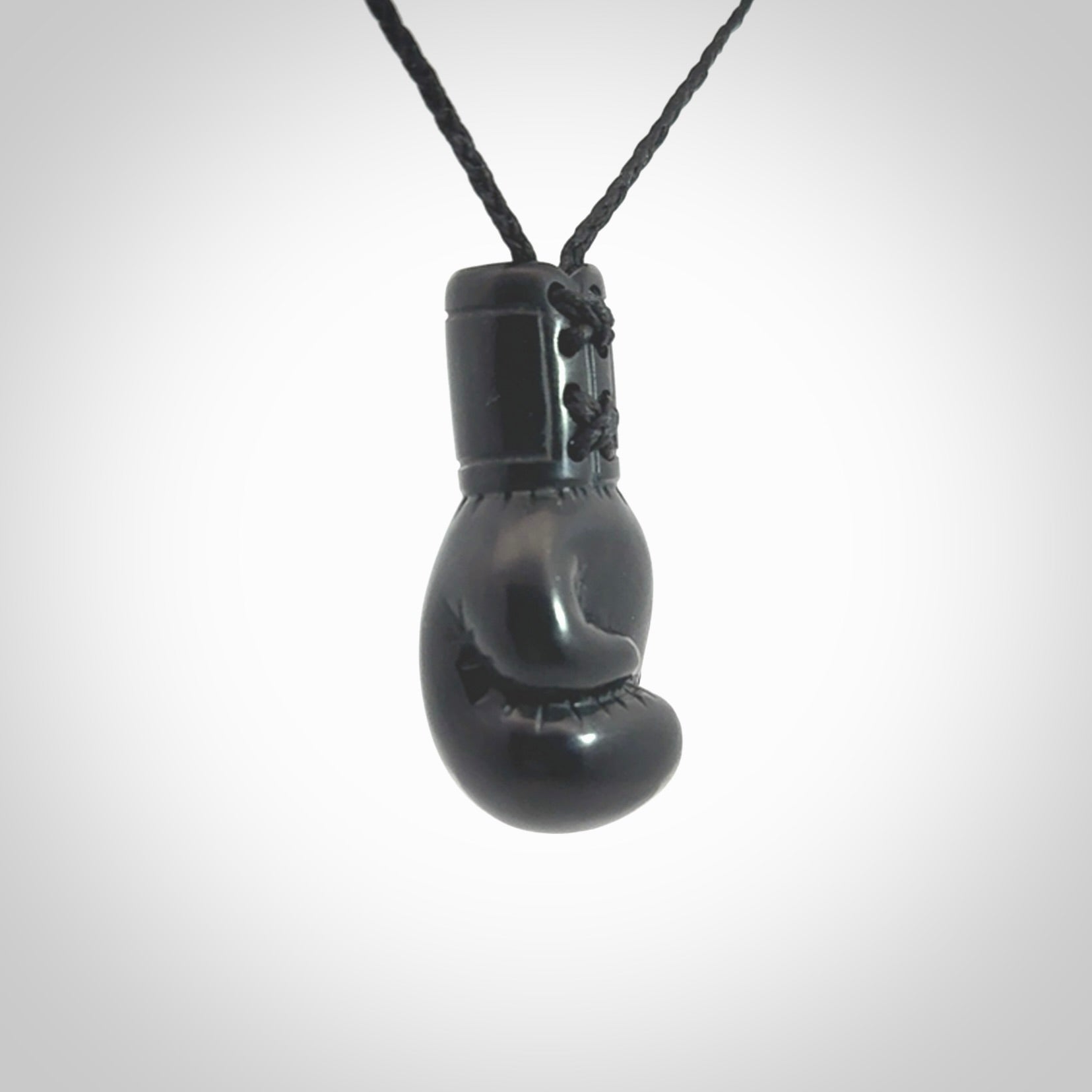 Hand carved boxing glove made from black jade. The cord is adjustable so that you can wear this where it suits you best. We ship these worldwide and the postage is included in the price.