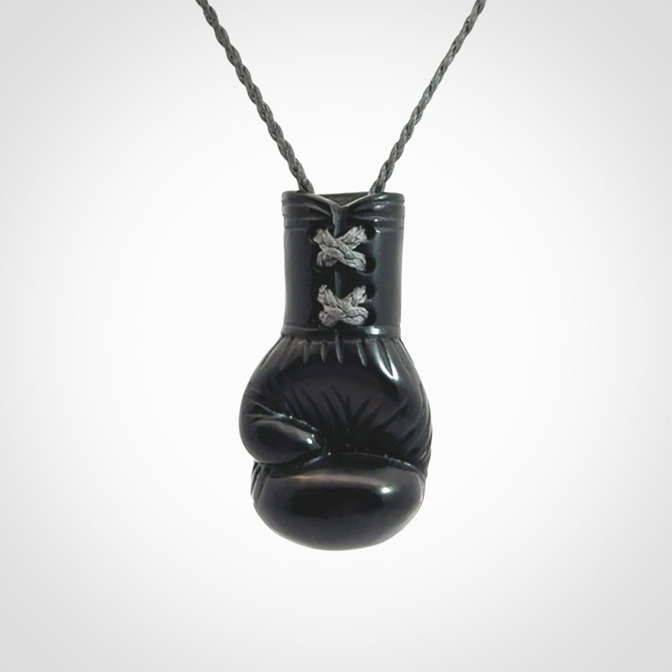 Hand Carved Black Jade Boxing Glove Pendant.