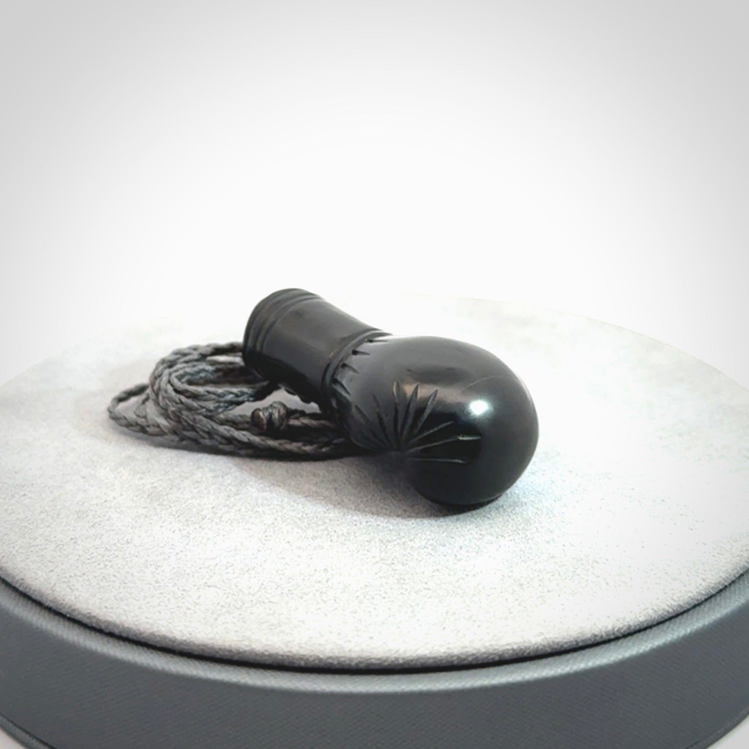 Hand Carved Black Jade Boxing Glove Pendant.