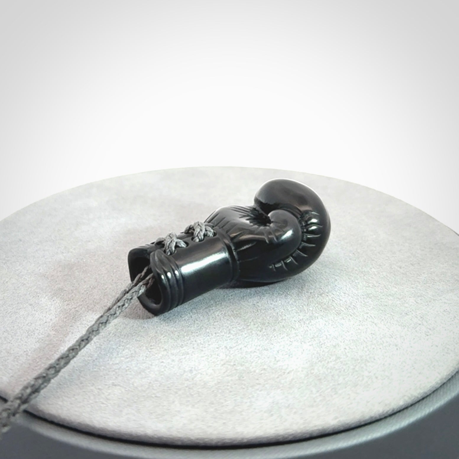 Hand Carved Black Jade Boxing Glove Pendant.