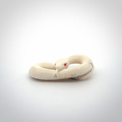 Hand carved red eyed white snake pendant made from Deer antler in New Zealand. Hand made by master bone carver Fumio Noguchi. Spectacular collectable work of art, made to wear. One only pendant, delivered to you at no extra cost with express courier.