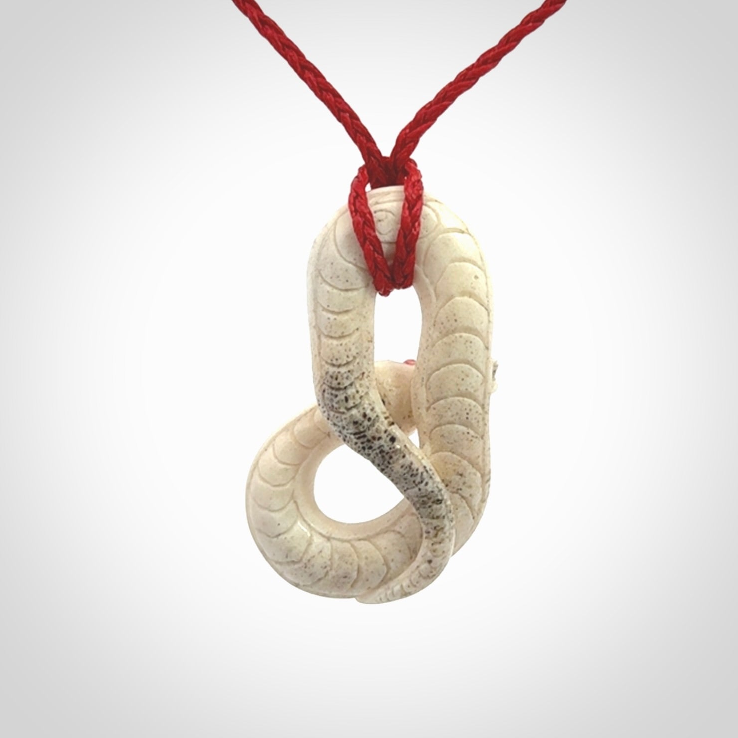 Hand carved red eyed white snake pendant made from Deer antler in New Zealand. Hand made by master bone carver Fumio Noguchi. Spectacular collectable work of art, made to wear. One only pendant, delivered to you at no extra cost with express courier.