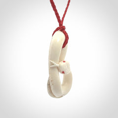 Hand carved red eyed white snake pendant made from Deer antler in New Zealand. Hand made by master bone carver Fumio Noguchi. Spectacular collectable work of art, made to wear. One only pendant, delivered to you at no extra cost with express courier.