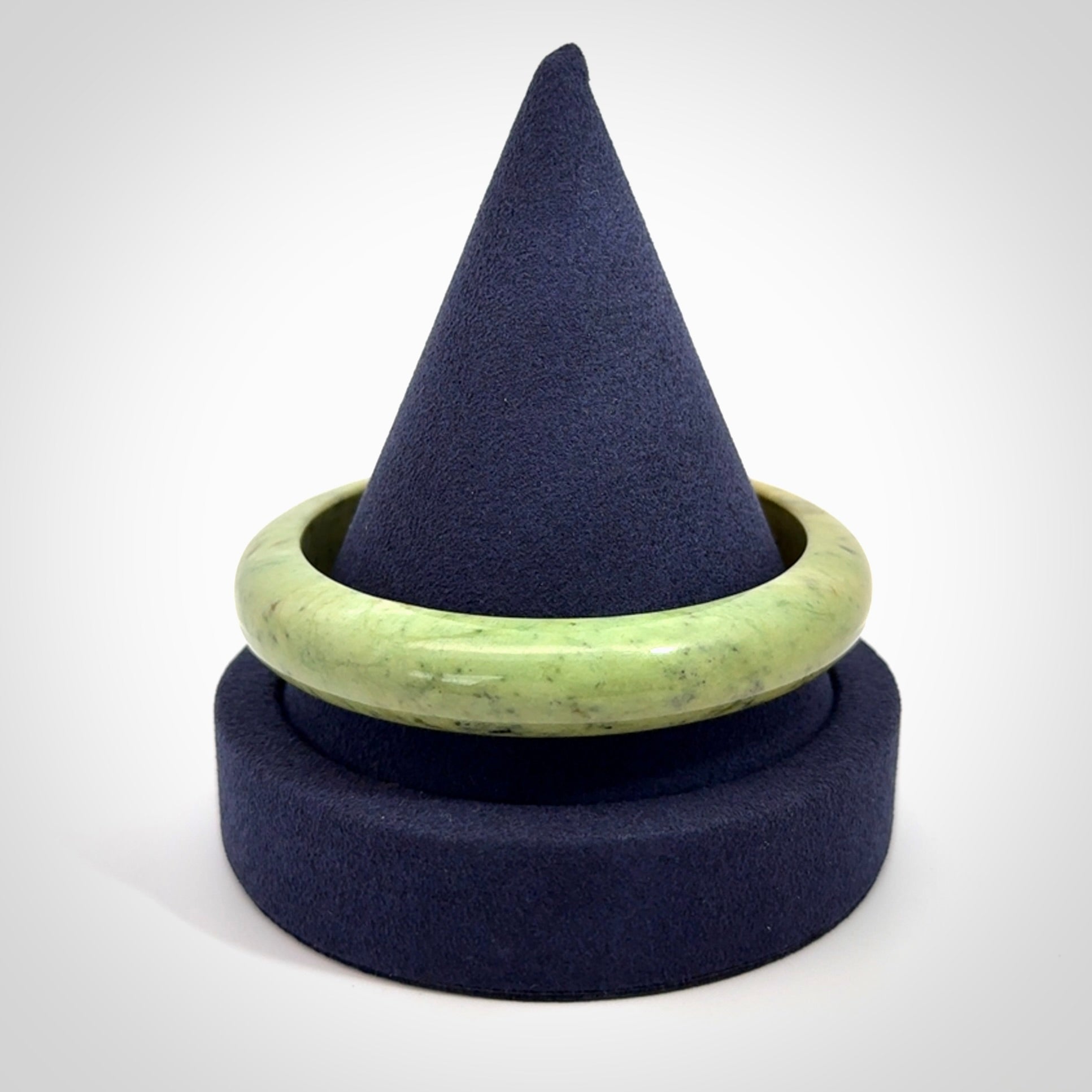 New Zealand flower jade bangle. This is carved from a solid piece of jade and polished to a mirror finish on the outside. The inside is a satin finish. The jade is high grade New Zealand Marsden and is a beautiful coloured stone.
