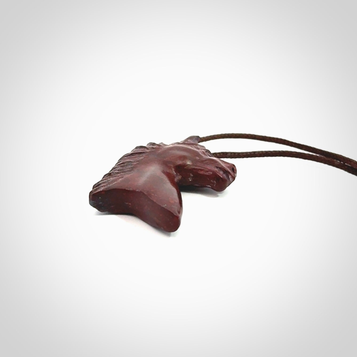 This medium sized horse pendant is made from Red Jasper Stone. We've hand carved this piece for all the horse lovers out there. Free postage worldwide. Red Jasper Stone horse head jewellery.