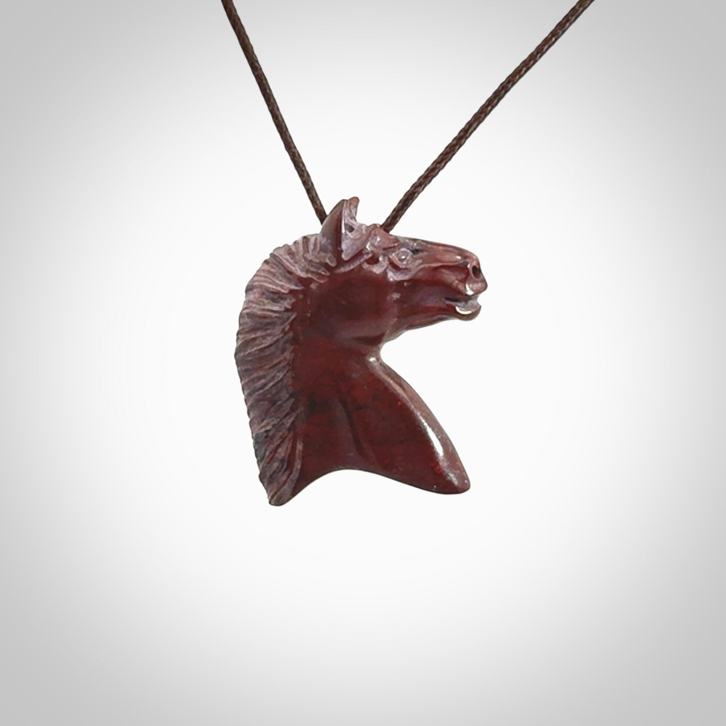 This medium sized horse pendant is made from Red Jasper Stone. We've hand carved this piece for all the horse lovers out there. Free postage worldwide. Red Jasper Stone horse head jewellery.
