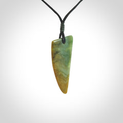 This photo shows a medium jade drop shaped pendant. It a a lovely varied green and orange New Zealand Marsden jade. The cord is black and is adjustable in length. One only medium, contemporary drop necklace from Jade.
