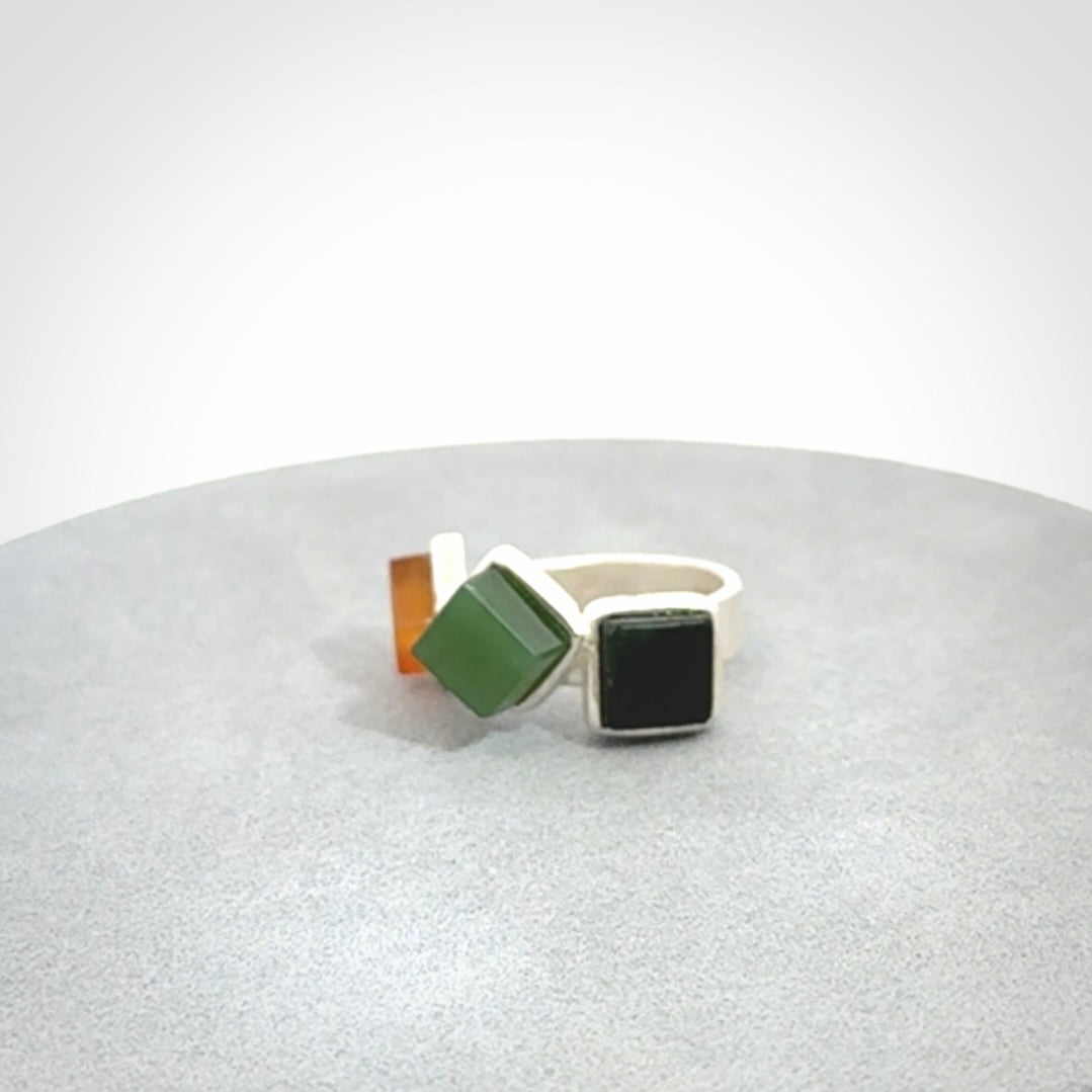 This is a handcrafted New Zealand Pounamu, Jade with Chalcedony and sterling silver ring. 