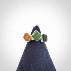 This is a handcrafted New Zealand Pounamu, Jade with Chalcedony and sterling silver ring. 