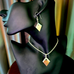 Hand carved mammoth tusk necklace and matching earrings.