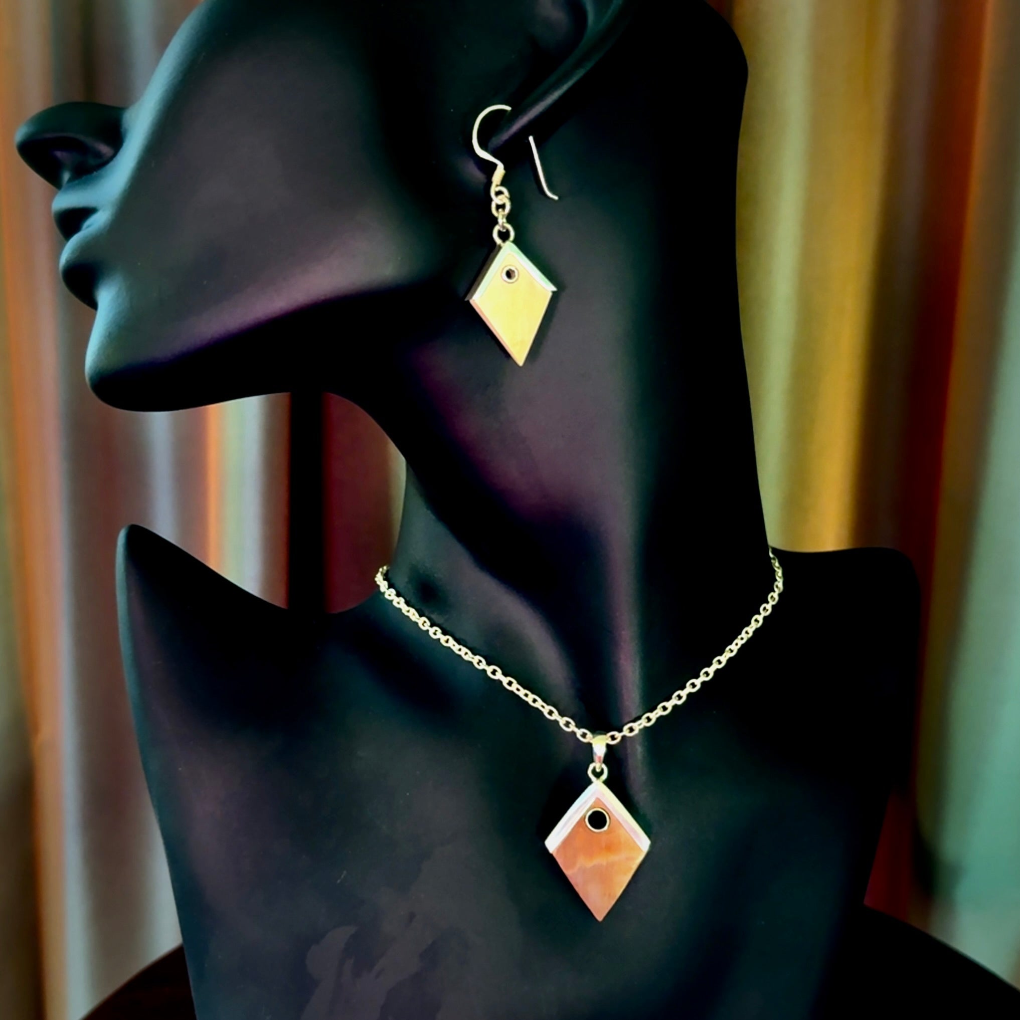 Hand carved mammoth tusk necklace and matching earrings.