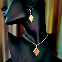 Hand carved mammoth tusk necklace and matching earrings.