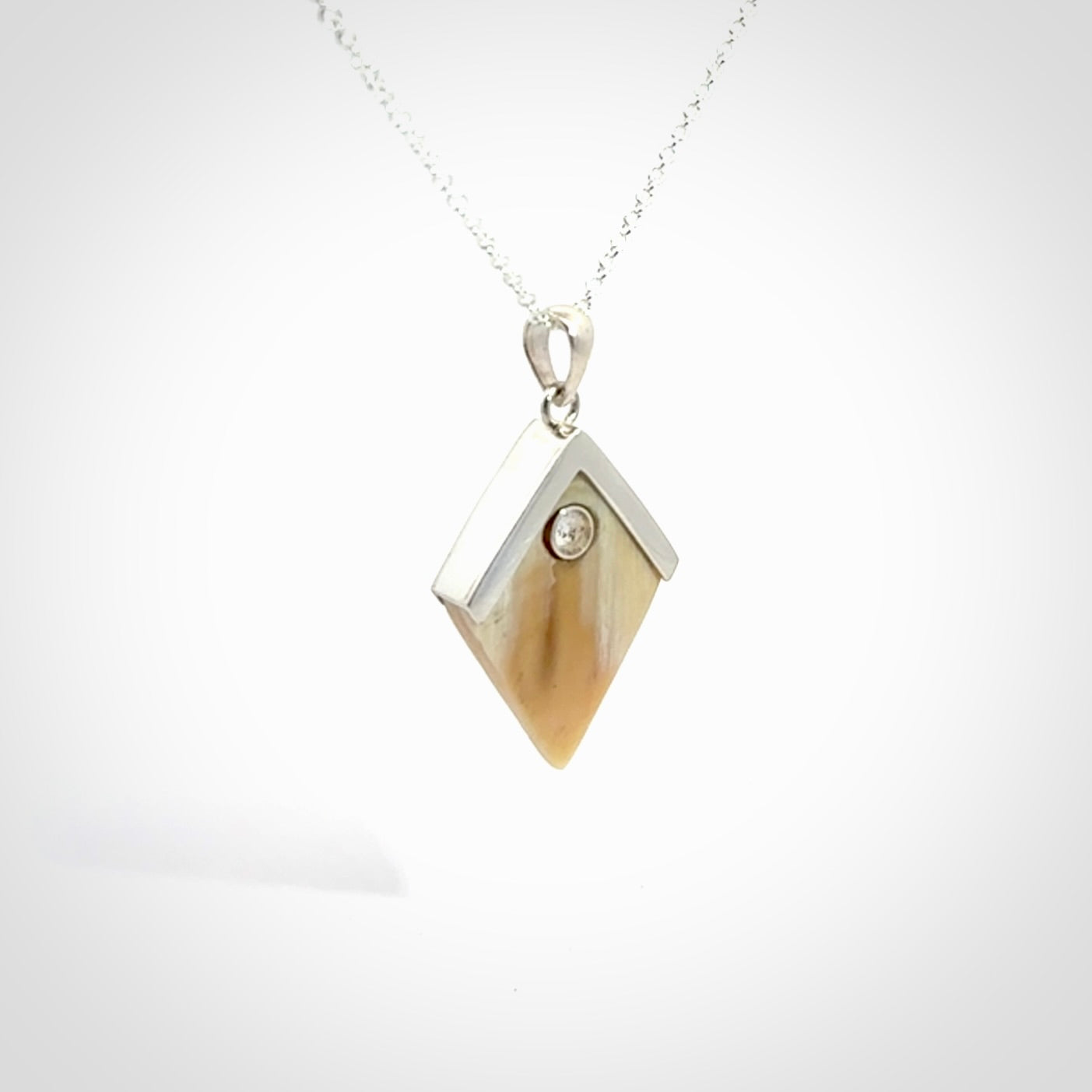 Hand carved mammoth tusk necklace. Made by NZ Pacific and for sale online only. Original and authentic handcrafted jewellery.