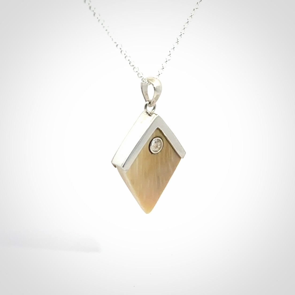 Hand carved mammoth tusk necklace. Made by NZ Pacific and for sale online only. Original and authentic handcrafted jewellery.