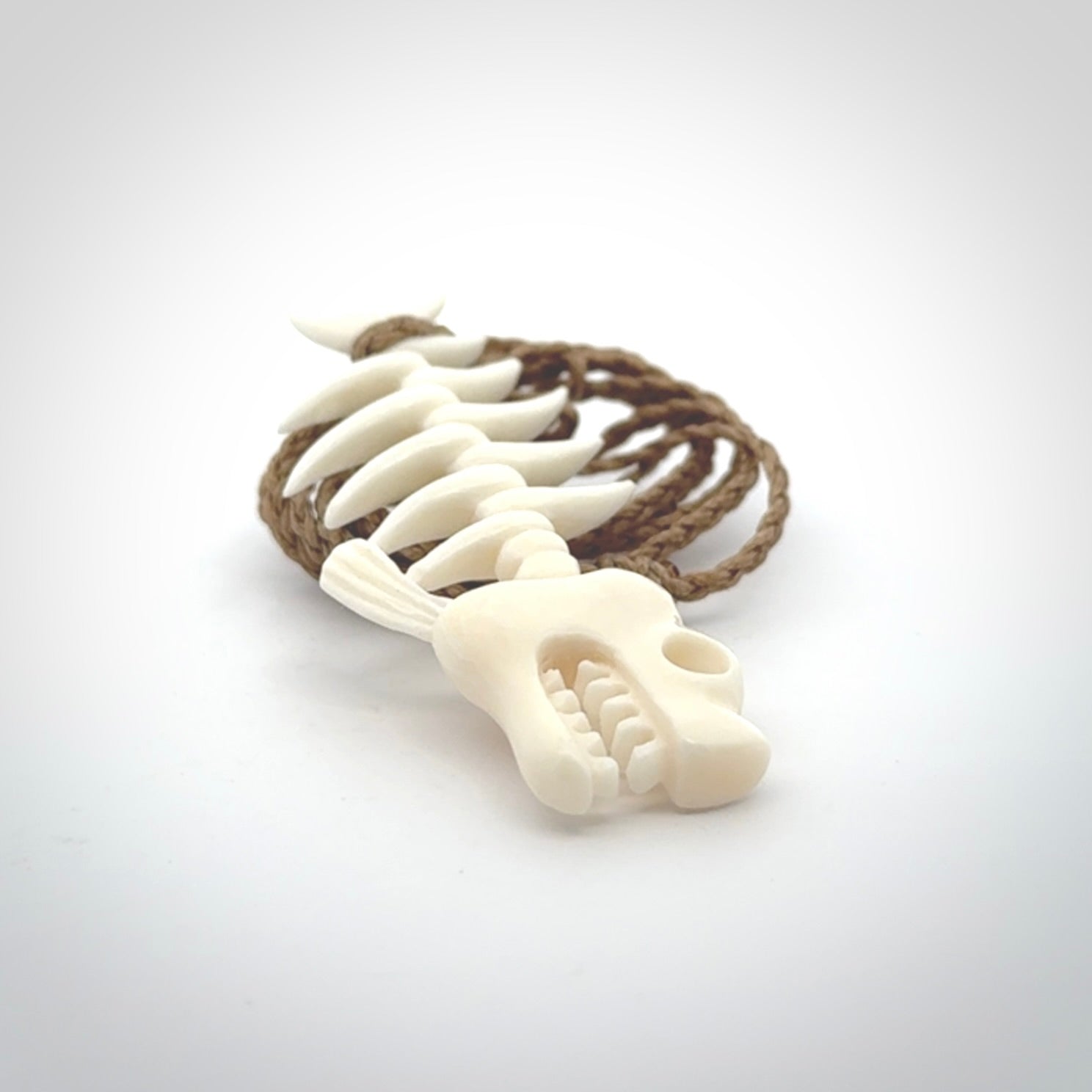 Hand carved bone fish skeleton pendant. Hand made bone fish necklace. Fish themed jewellery. Ocean themed pendant. One only necklace provided with adjustable cord and free delivery.