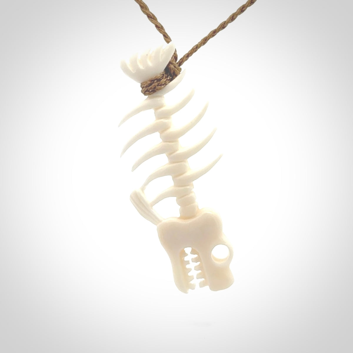 Hand carved bone fish skeleton pendant. Hand made bone fish necklace. Fish themed jewellery. Ocean themed pendant. One only necklace provided with adjustable cord and free delivery.