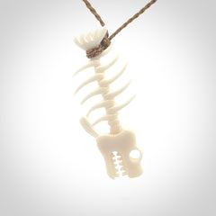 Hand carved bone fish skeleton pendant. Hand made bone fish necklace. Fish themed jewellery. Ocean themed pendant. One only necklace provided with adjustable cord and free delivery.