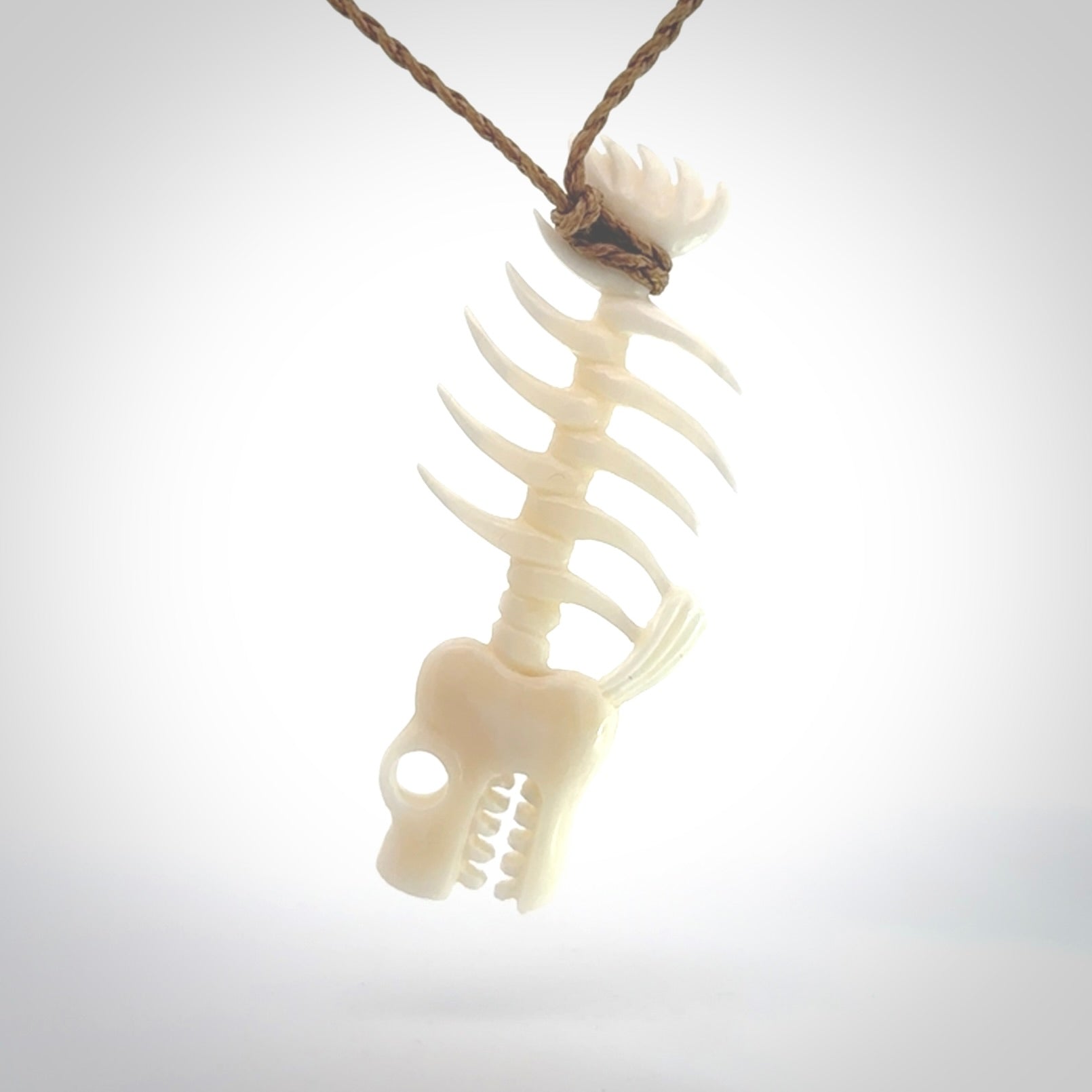 Hand carved bone fish skeleton pendant. Hand made bone fish necklace. Fish themed jewellery. Ocean themed pendant. One only necklace provided with adjustable cord and free delivery.