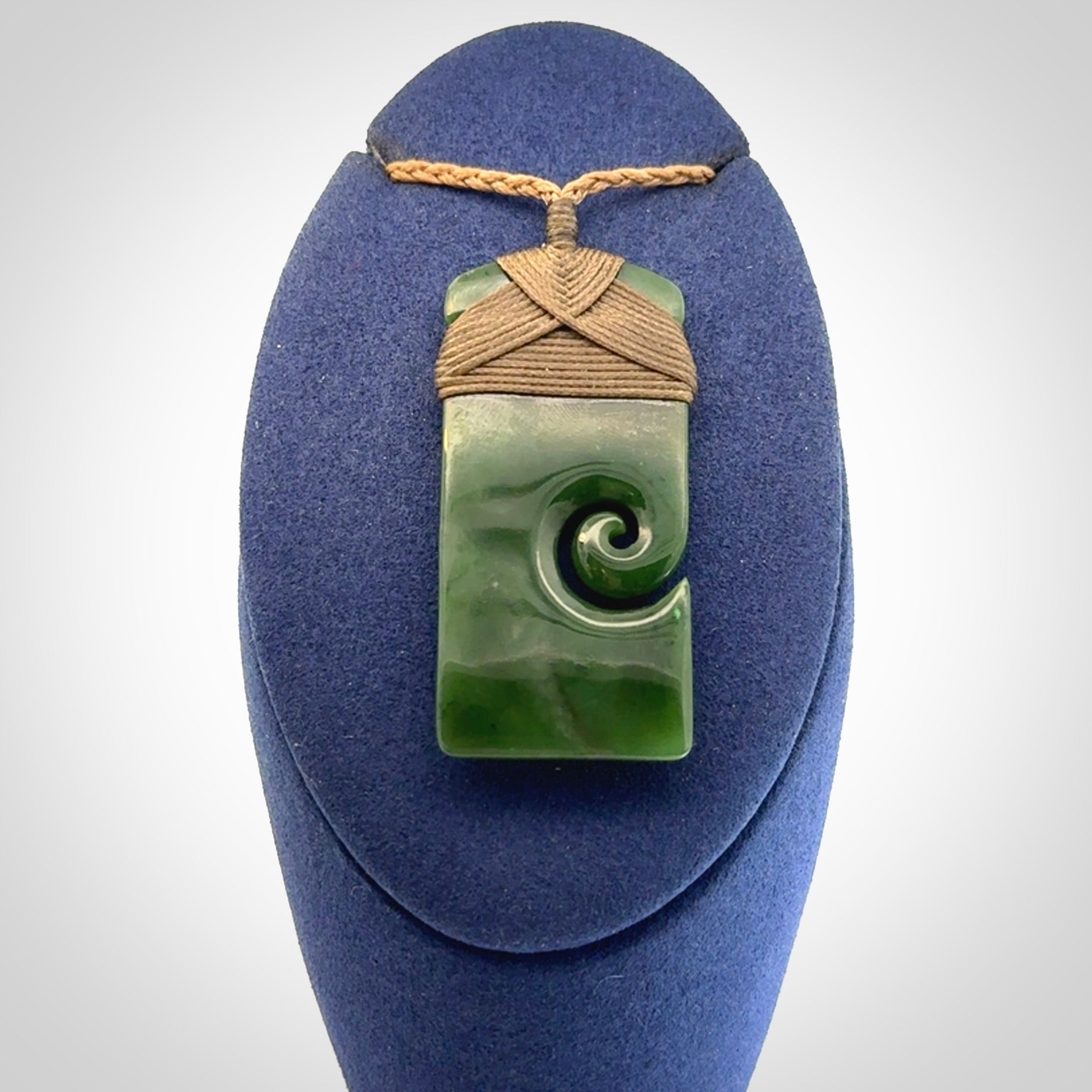Hand carved British Columbian Jade Toki with koru pendant