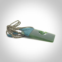 British Coloumbian jade toki koru pendant. Hand carved in New Zealand. Hand made British Coloumbian Jade jewellery. Provided with an adjustable cord and packaged in a woven kete pouch.