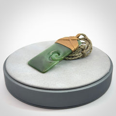 Hand carved British Columbian Jade Toki with koru pendant