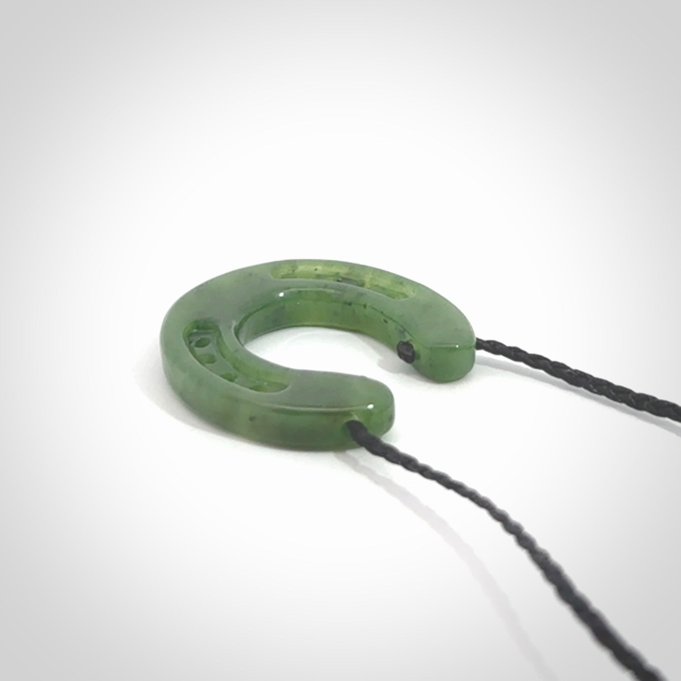 This is a beautiful horseshoe pendant hand carved in British Columbian jade. Hand carved for all the horse lovers out there. Free postage worldwide. Jade horseshoe jewellery.
