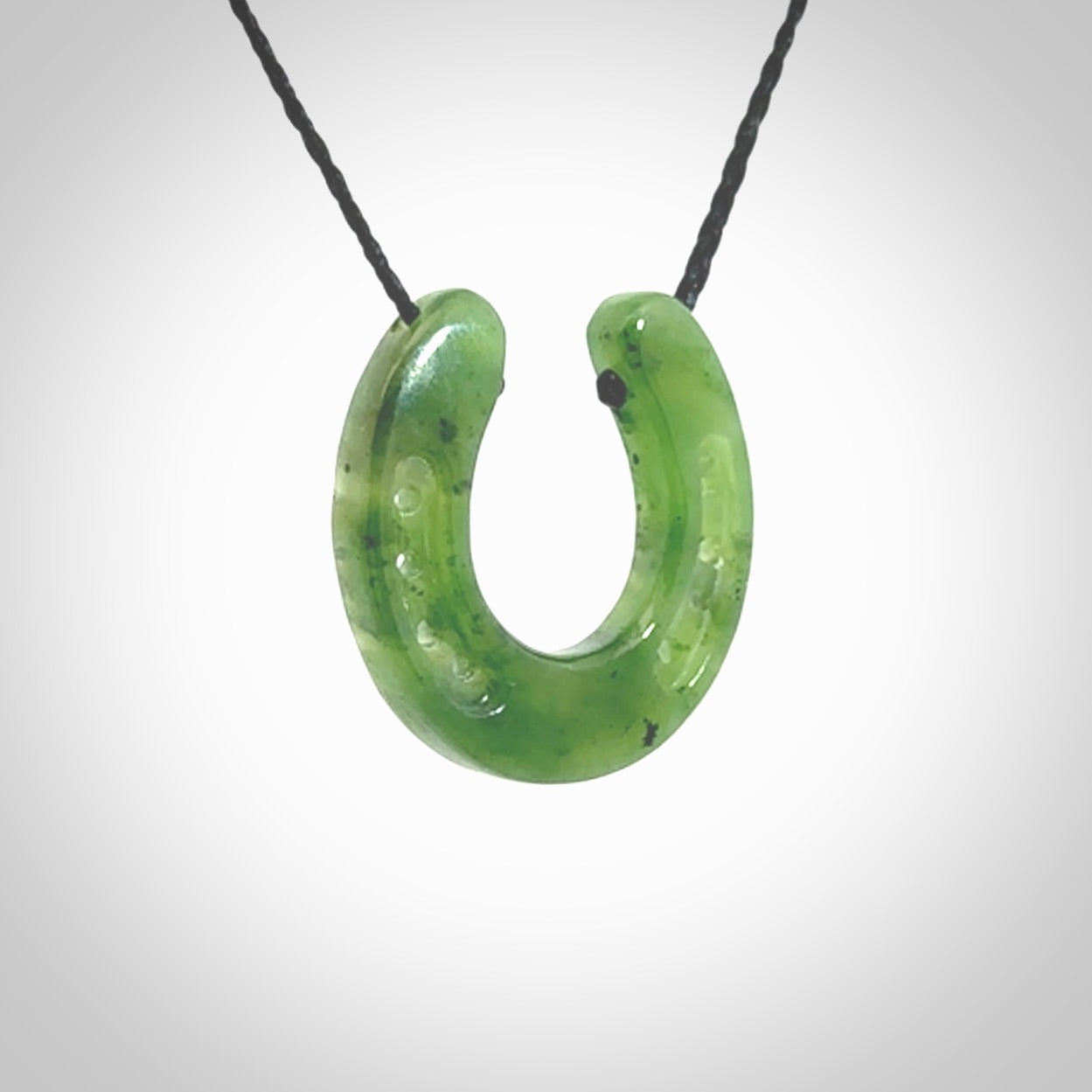 This is a beautiful horseshoe pendant hand carved in British Columbian jade. Hand carved for all the horse lovers out there. Free postage worldwide. Jade horseshoe jewellery.