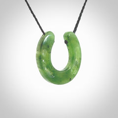 This is a beautiful horseshoe pendant hand carved in British Columbian jade. Hand carved for all the horse lovers out there. Free postage worldwide. Jade horseshoe jewellery.