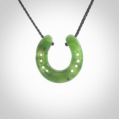 This is a beautiful horseshoe pendant hand carved in British Columbian jade. Hand carved for all the horse lovers out there. Free postage worldwide. Jade horseshoe jewellery.