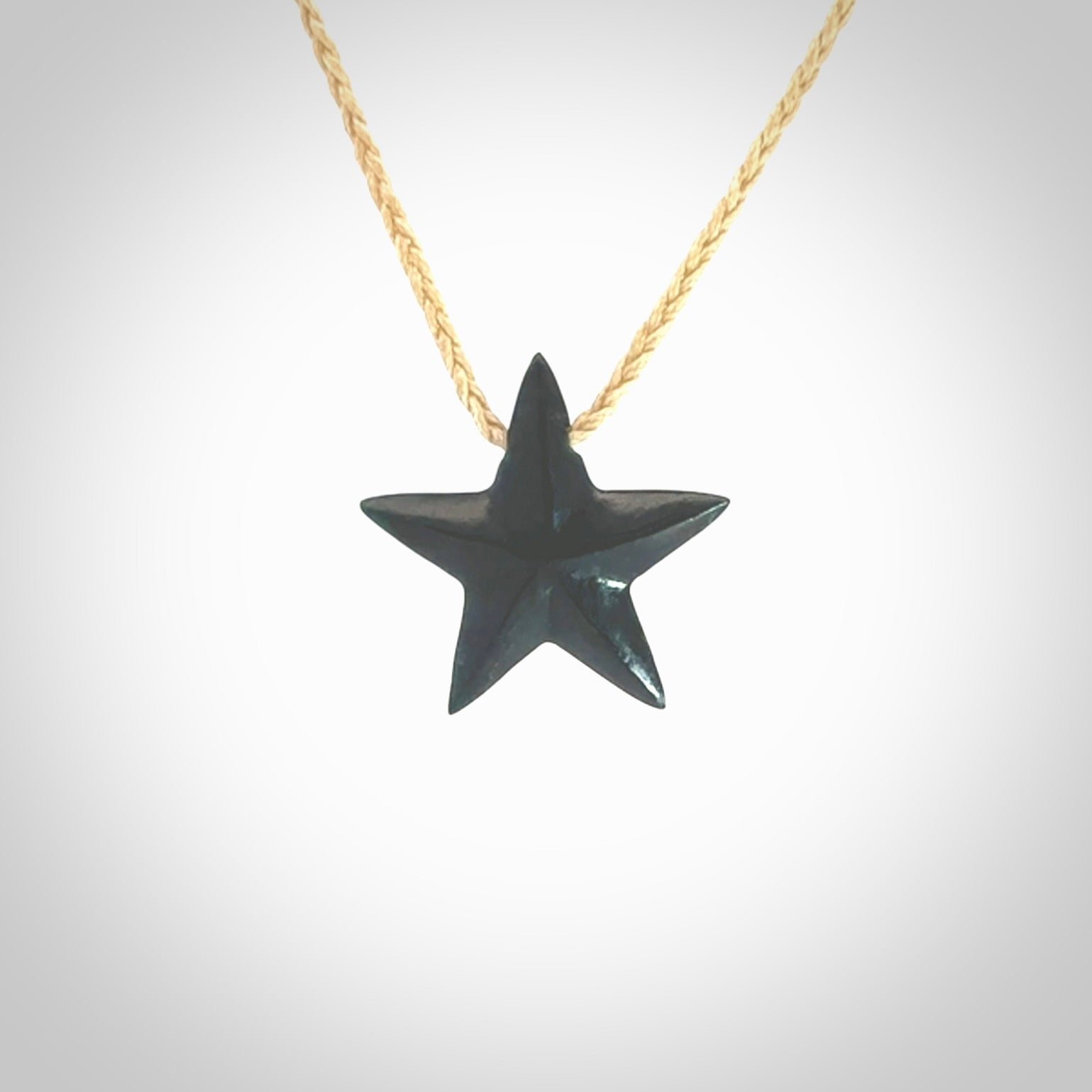 Hand carved black jade star pendant. Hand made black jade star pendant with adjustable cord.