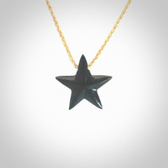 Hand carved black jade star pendant. Hand made black jade star pendant with adjustable cord.
